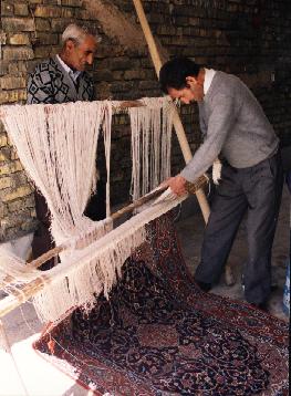 Isfahan Rugs Persian Rugs Mr. Malakouti (the father) inspecting one of the almost finished carpets